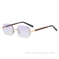 New European and American fashion frameless polygon Sunglasses Women's gradually changing color Sunglasses trend wood grain leg